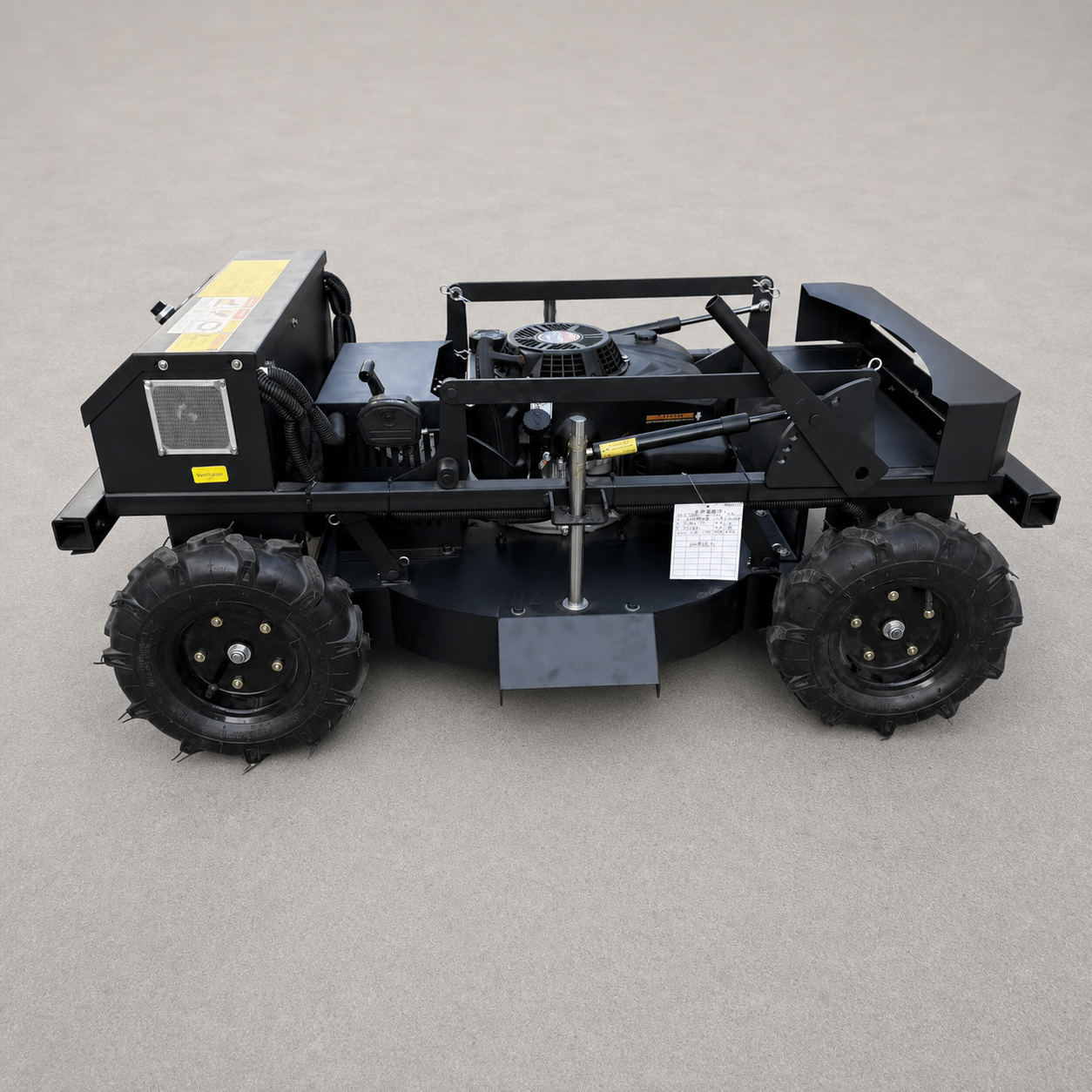 Compact tracked mower on lawn